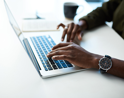 Job seeker applying for an office position on their laptop