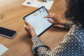 Administrative employee checking job trends on her tablet